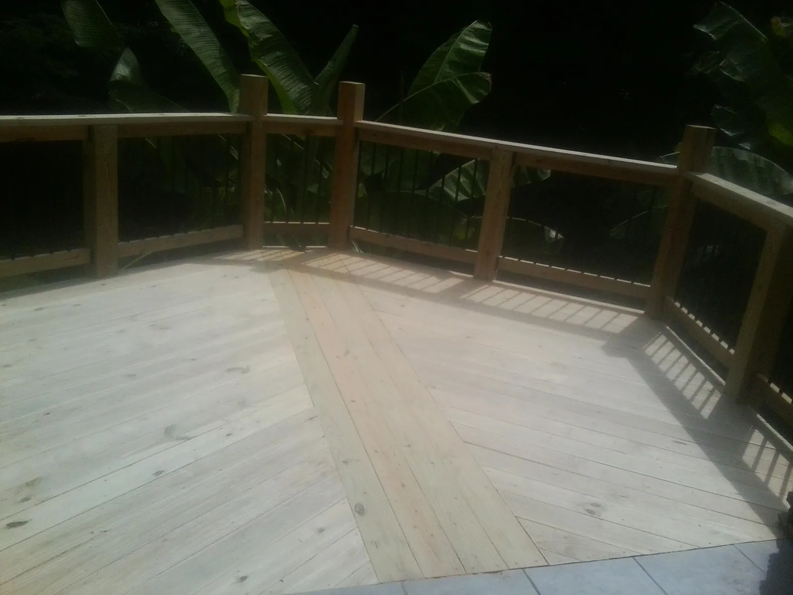 New wood deck and railing built off the back of a home in Richfield
